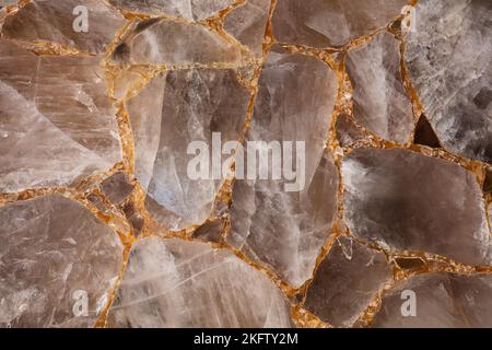 Brown smoky quartz stone slab. Gemstone background. Matt natural semi precious mineral pattern. Semiprecious texture for ceramic wall, floor digital Stock Photo