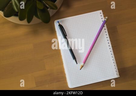 Notebook with pen and pencil. Home office Stock Photo