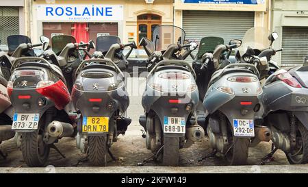 PARIS, FRANCE - AUGUST 09, 2015: close up shot of scooters parked in the street of Paris. Stock Photo