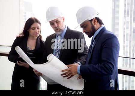 Senior architect and secretary inspector check blueprint and structure with contractor together at office, executive and supervisor or engineer planni Stock Photo