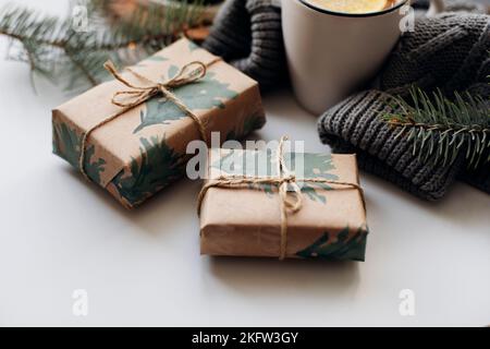 Two wrapping gift boxes on white background. Cozy mood christmas concept. Stock Photo