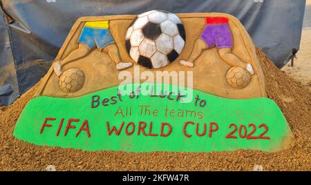 Pushkar, Rajasthan, India, November 20, 2022: Sand artist Ajay Rawat creates a sand art to wish the all teams of FIFA World Cup Qatar 2022. Credit: Sumit Saraswat/Alamy Live News Stock Photo