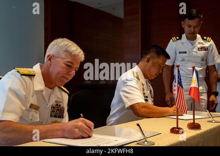 221011-N-DB724-1011  CEBU, Philippines (Oct. 11, 2022) Vice Adm. Karl Thomas, commander, U.S. 7th Fleet, and Rear Adm. Nichols Driz, commander, Philippine Fleet, both sign terms of reference for staff-to-staff talks in Cebu, Philippines, Oct. 11. Sama Sama-Lumbas is a multilateral exercise and includes forces from Philippines, the United States, Australia, France, Japan, and the United Kingdom designed to promote regional security cooperation, maintain and strengthen maritime partnerships, and enhance maritime interoperability. Stock Photo