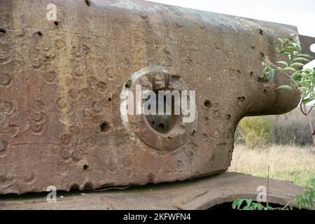 rust covered carcass of an abandoned wrecked rusting British Centurion main battle tank in afternoon sunlight Stock Photo