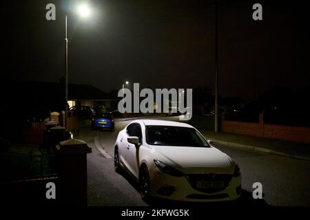 bright daylight light led low energy street lighting in a residential street in newtownabbey northern ireland uk Stock Photo