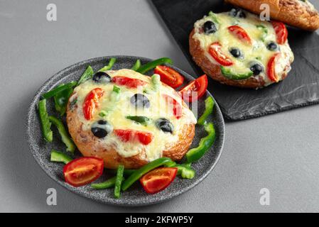 Pizza, southern india, with peppers and tomatoes. Covered with delicious ingredients. Homemade Indian Chicken Tikka Masala PIzza with Onions and Stock Photo