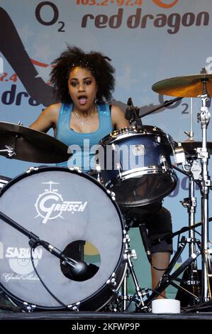 Cherisse Osei, drummer with the FADERS, at Red Dragon Party In The Park in Cardiff, Wales, June 19 2005. Photograph: ROB WATKINS.  INFO: The Faders was a British all-girl pop rock band formed in 2004. Known for their energetic style and catchy songs, they gained attention with hits like "No Sleep Tonight" and "Jump," before disbanding in 2006 after a brief but impactful run. Stock Photo