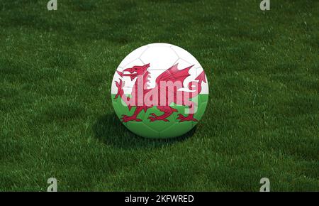 Soccer ball with wales flag colors at a stadium on green grasses background. 3D illustration. Stock Photo