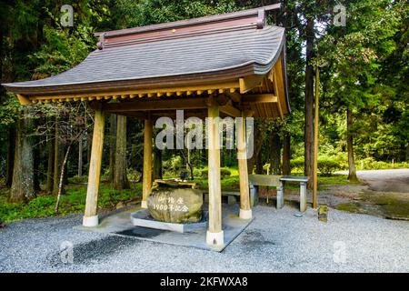 Yamamiya Sengen Shrine temple water dragon purification ritual outdoors Stock Photo