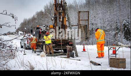 Geotechnical investigation by drilling on a country road in winter Stock Photo