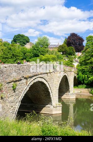 Ludlow Shropshire Dinham Bridge with people crossing the River Teme over Dinham bridge Ludlow Shropshire England UK GB Europe Stock Photo