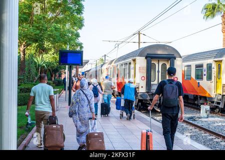 Rail travel in Morocco - passengers about to board a train at Marrakech railway station Stock Photo