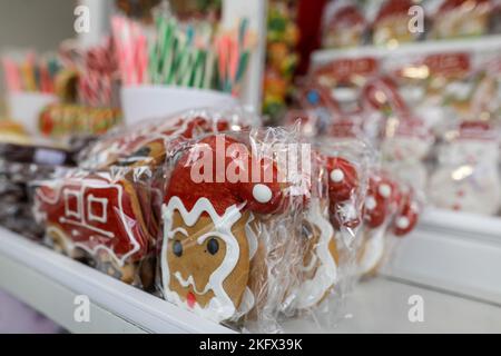 Shallow depth of field (selective focus) details with gingerbread for sale at a Christmas market. Stock Photo