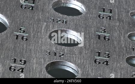 Drill Bit Gauge Close up on dark background Stock Photo