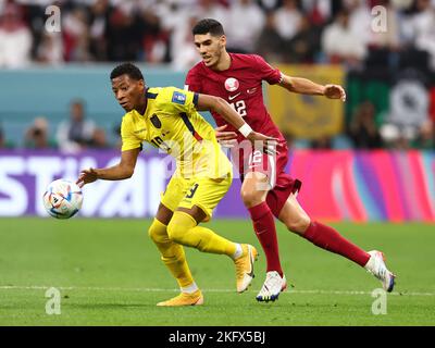 Al Khor, Qatar. 20th Nov, 2022. Gonzalo Plata of Equador tackled by Karim Boudiaf of Qatar during the FIFA World Cup 2022 match at Al Bayt Stadium, Al Khor. Picture credit should read: David Klein/Sportimage Credit: Sportimage/Alamy Live News Stock Photo