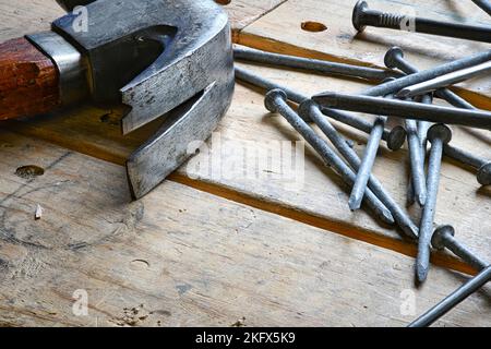 Hammer and Nails on Wood Table Stock Photo