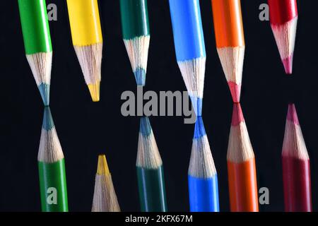 Colored Pencil points on dark glass Stock Photo