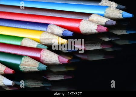 Colored Pencil Points on dark glass Stock Photo