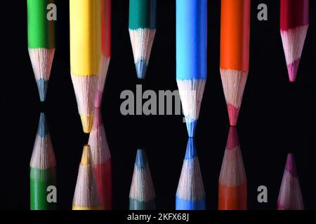 Colored Pencil points on dark glass Stock Photo