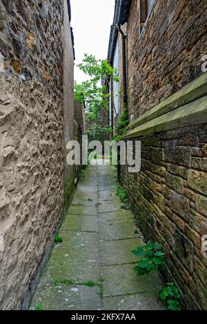 Narrow alley between buildings Stock Photo