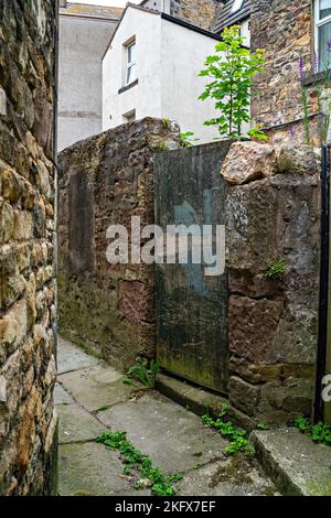 Narrow alley between buildings Stock Photo