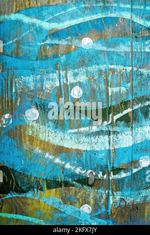 Wave patterns painted on wooden fence Stock Photo