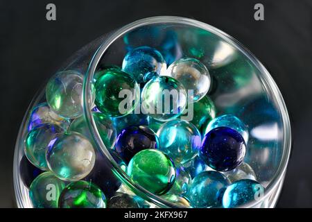 Blue Marbles in Wine Glass Stock Photo
