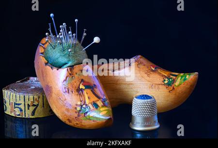 Antique Sewing Pin Cushions with Measuring Tape and Thimble. Stock Photo