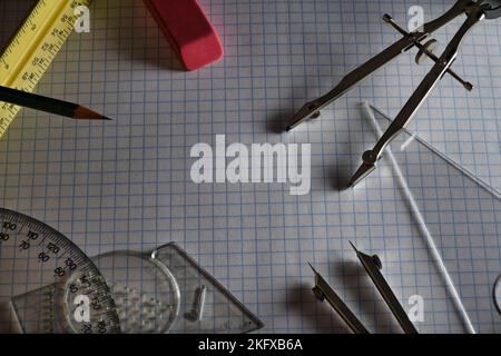 Drafting Tools on Grid Paper close up Stock Photo