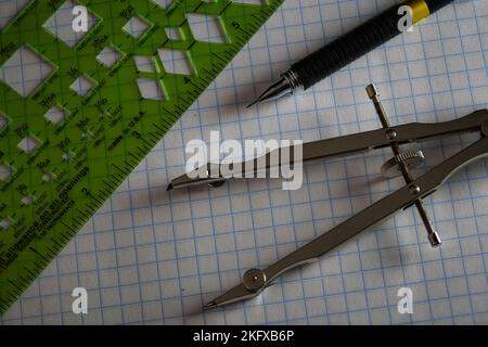 Drafting Tools on Grid Paper close up Stock Photo