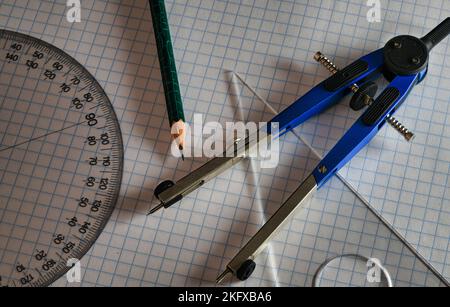 Drafting Tools on Grid Paper close up Stock Photo