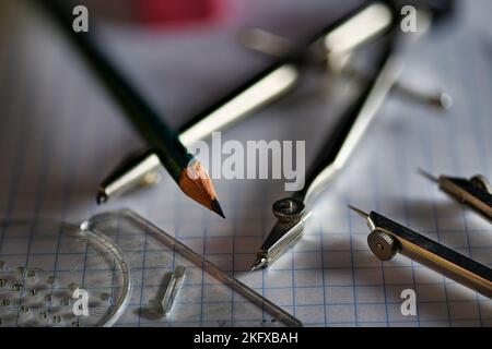 Drafting Tools on Grid Paper close up Stock Photo