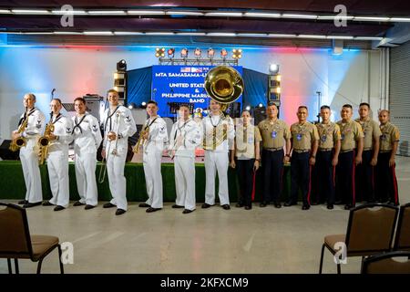 221013-N-DB724-2065  CEBU, Philippines (Oct. 13, 2022) Sailors, assigned to the U.S. 7th Fleet Band, and marines, assigned to the Philippine Marine Corps Band, pose for a group photo before a performance at SM Seaside City Cebu mall during Exercise Sama Sama-Lumbas 2022 in Cebu, Philippines, Oct. 13. Sama Sama-Lumbas is a multilateral exercise and includes forces from Philippines, the United States, Australia, France, Japan, and the United Kingdom designed to promote regional security cooperation, maintain and strengthen maritime partnerships, and enhance maritime interoperability. Stock Photo