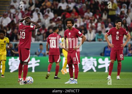 Doha, Katar. 20th Nov, 2022. Player Qataror after versustor, disappointed, frustrated, dejected, action. From left: ALMOEZ ALI (Qatar), HASSAN ALHAYDOS (Qatar), AKRAM AFIF (Qatar), KARIM BOUDIAF (Qatar). Game 1, Group A Qatar - Ecuador, on 20/11/2022, Al Bayt Stadium. Soccer World Cup 20122 in Qatar from 20.11. - 18.12.2022 ? Credit: dpa/Alamy Live News Stock Photo