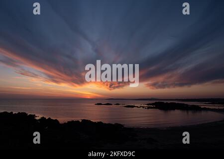Sunset over Porth Noble bay Anglesey Stock Photo