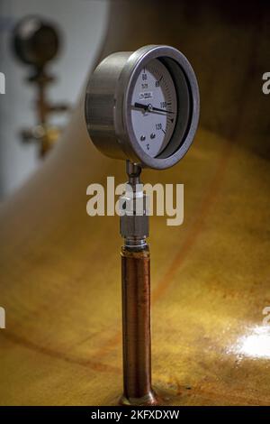 Alcohol Temperature Gauge at Copper Still Distillery Brewery ,Isle of Harris Distillery, Scotland Stock Photo