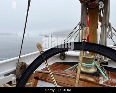 Looking out over the foggy harbour from the deck of the Bluenose II. Lunenburg, Nova Scotia, Canada September 27 2022 Stock Photo