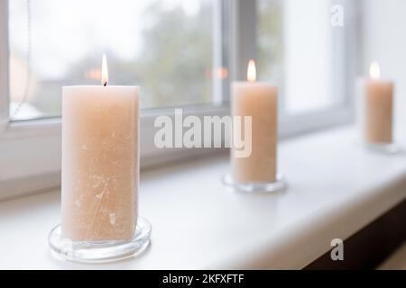 SPA accessories. Scented candles on the windowsill. Stock Photo