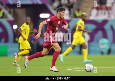 Al Khor, Qatar. 20th Nov, 2022. Karim Boudiaf of Qatar dribbles the ball during the FIFA World Cup Qatar 2022 Group A match between Qatar and Ecuador at Al Bayt Stadium, Al Khor, Qatar on 20 November 2022. Photo by Peter Dovgan. Editorial use only, license required for commercial use. No use in betting, games or a single club/league/player publications. Credit: UK Sports Pics Ltd/Alamy Live News Stock Photo