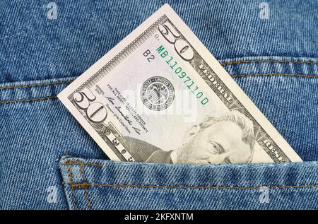 Business and finance concept. There's a fifty dollar bill in my jeans pocket. Stock Photo