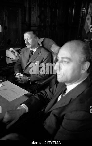 Juan Carlos Onganía, Argentine defacto president, helds a cabinet meeting. At his left Rubens San Sebastián, secretary, circa 1969 Stock Photo