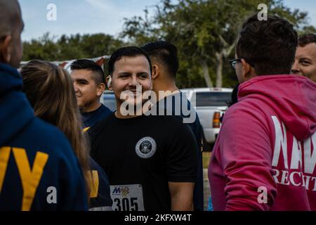 Students and staff members at the Navy Recruiting Orientation Unit (NORU), located on NAS Pensacola, FL, participated in a 5K hosted by the MWR. The event commemorated the Navy's 247th birthday on October 13th, 2022. Stock Photo