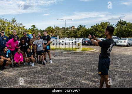 Students and staff members at the Navy Recruiting Orientation Unit (NORU), located on NAS Pensacola, FL, participated in a 5K hosted by the MWR. The event commemorated the Navy's 247th birthday on October 13th, 2022. Stock Photo