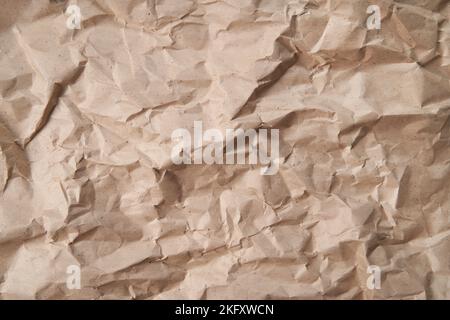 Texture of crumpled kraft paper for background. An excellent blank for your text or your design. Copy Space. The concept of ecology, recycling, zero waste. Stock Photo