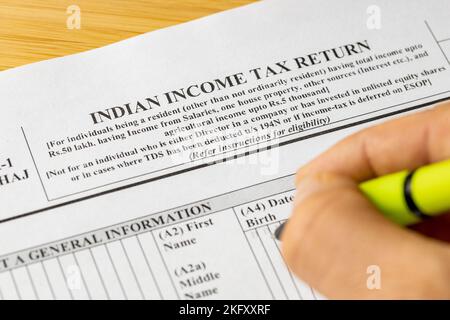 India income tax return, ITR1 form and hand with pen of person filling out tax return Stock Photo