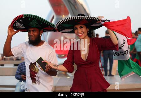 Doha, Qatar. 20th Nov, 2022. Fans celebrate for the opening day of 2022 Qatar FIFA World Cup at Al Bidda park in Doha, Qatar, Nov. 20, 2022. Credit: Meng Yongmin/Xinhua/Alamy Live News Stock Photo