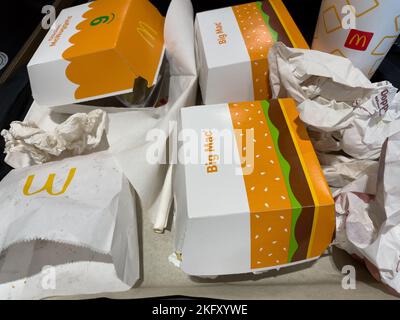 Weissenburg, Germany, 09 Oktober 2022: Used paper dispoable packs McDonalds. Fast food’s litter legacy from a meal. Stock Photo