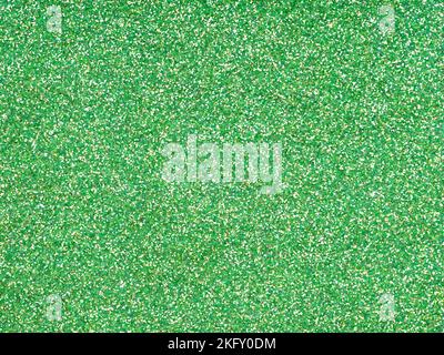Soft green glitter. Perfect holographic background or pattern of sparkling shiny glitter for decoration and design of Christmas, New Year, Patrick Day Stock Photo