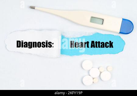 Medical diagnosis. A gap is made in the middle of the white sheet, inside of which there is an inscription - Heart Attack on a blue background. On the Stock Photo