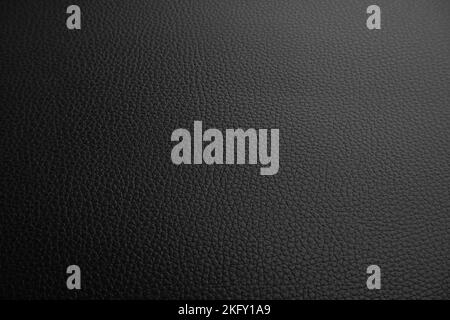 Black leather textured background with a lowlight Stock Photo